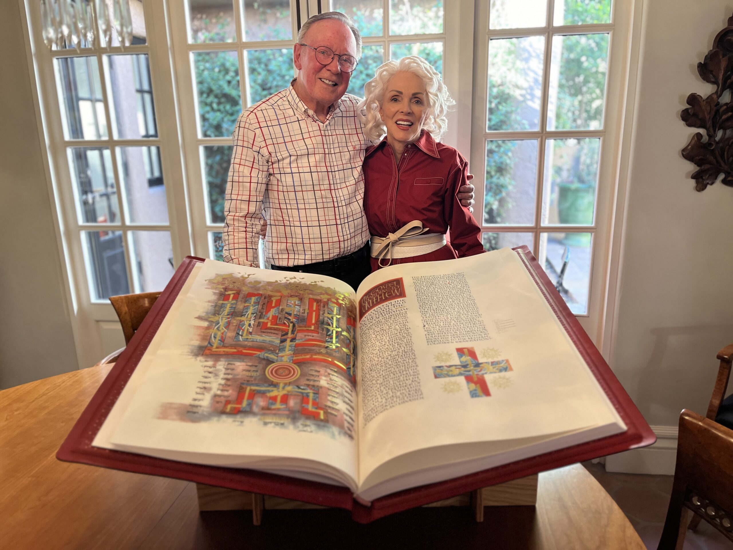 Jolyon and Charlotte Grant stand behind The Saint John's Bible