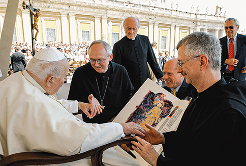 On May 26, 2004, a delegation from the project presents a facsimile of the Bible to Pope John Paul II in Rome.