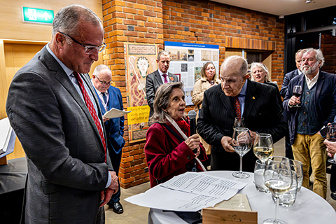 Elaine Culver (middle) stands between Saint John’s University President Brian Bruess (left) and her husband Bruce (right) as she shares remarks after the gift of an Apostles Edition of The Saint John’s Bible was blessed and dedicated at Lambeth Palace Library. 
