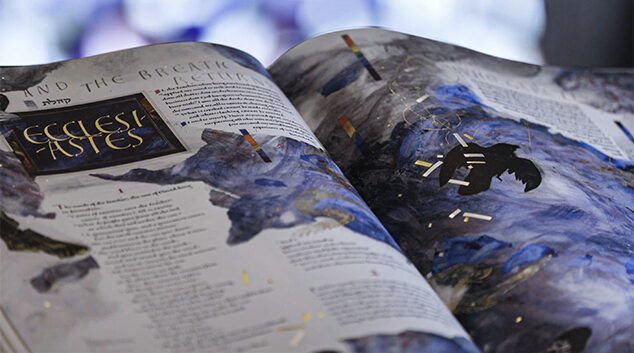 One volume of The Saint John’s Bible Heritage Edition open to the Ecclesiastes illumination. 