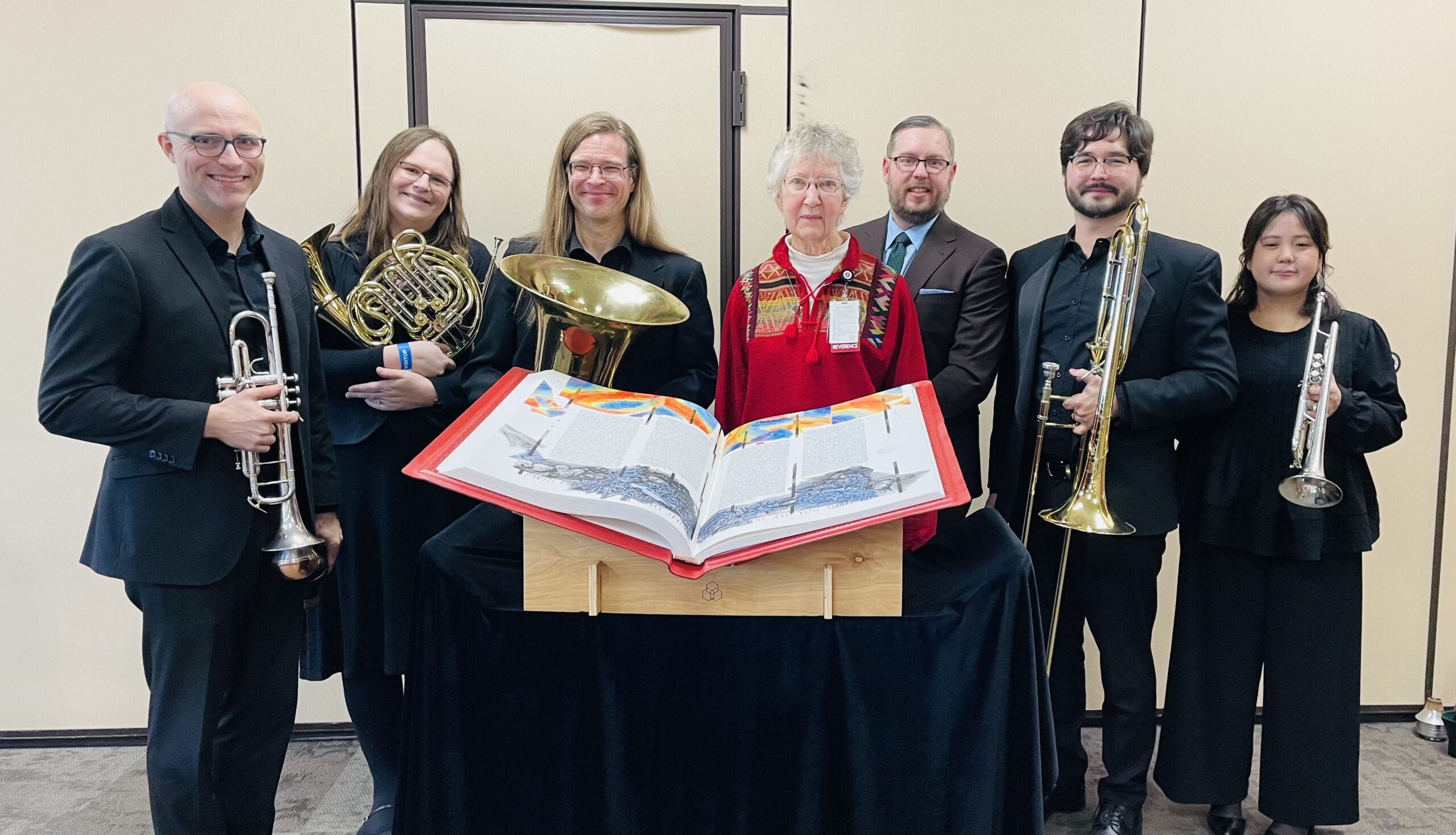 Members of the Boise Philharmonic stand with Sister Beth and Brandon VanWaeyenberghe, Executive Director of the Boise Philharmonic, behind the Heritage Edition.