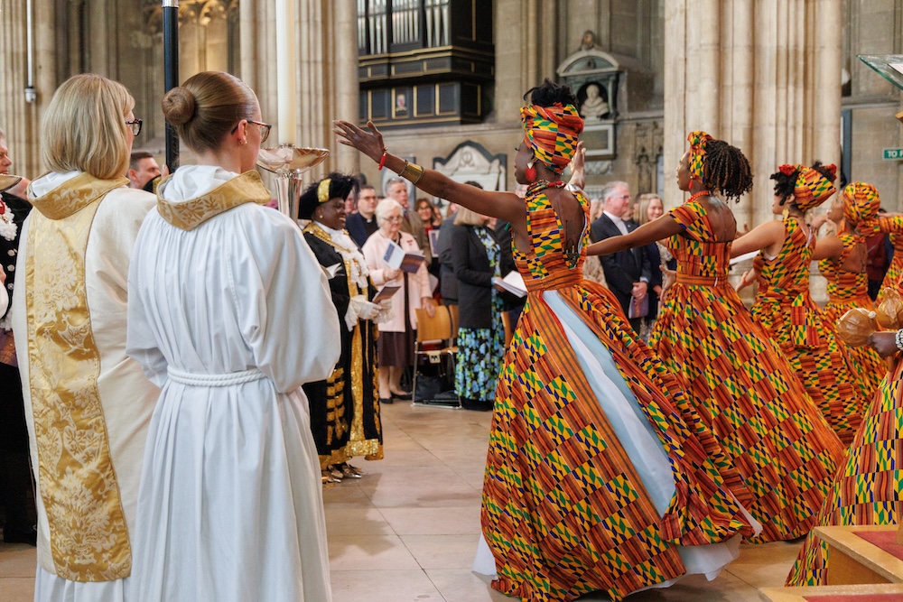 The African Choir of Norfolk performs at the Installation of Archbishop Sarah Mullally. Look closely and you’ll see Rev. Dr. Ross and Mrs. Ross in the very front row.